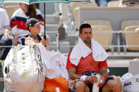 Serbia's Novak Djokovic rests during the changeover of his quarter final match of the French Open tennis tournament against Russia's Karen Khachanov at the Roland Garros stadium in Paris, Tuesday, June 6, 2023. (AP Photo/Jean-Francois Badias)