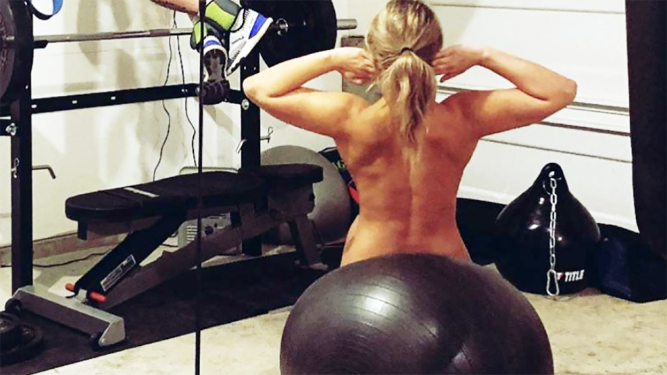 Paige VanZant, pictured here working out in the nude at home.