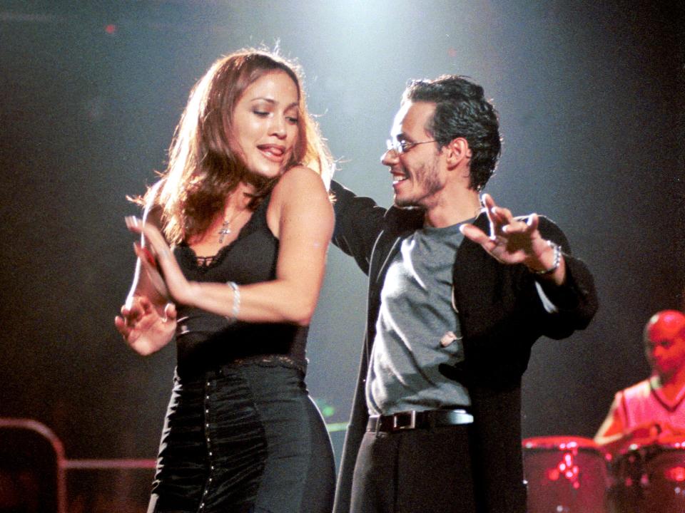 American Latin and pop singer Marc Anthony (born Marco Antonio Muniz) performs onstage with Jennifer Lopez at Madison Square Garden concert, New York, New York, September 26, 1998.