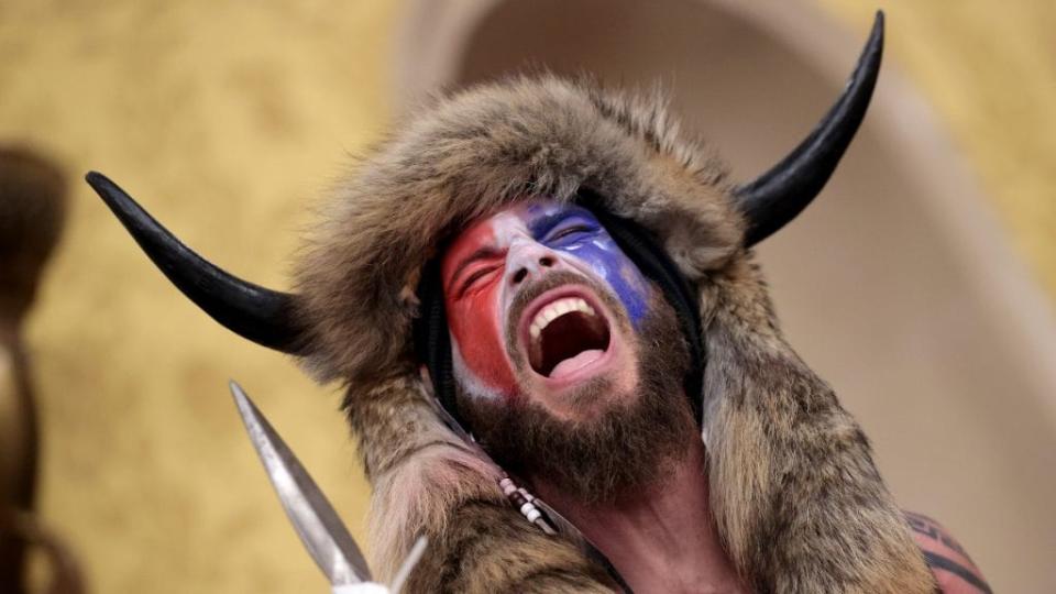 Jacob Anthony Chansley, also known as Jake Angeli, screams “Freedom!” inside the Senate chamber after breaching the U.S. Capitol with a pro-Trump mob during a joint session of Congress last Wednesday in Washington, D.C. (Photo by Win McNamee/Getty Images)