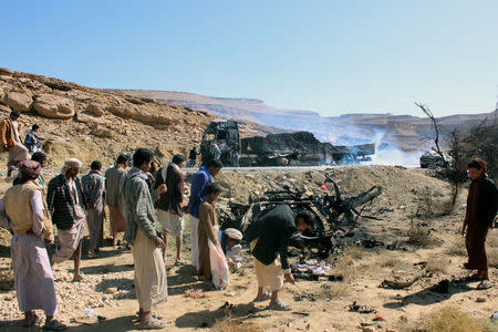 People inspect the damage after an air strike by the Saudi-led coalition in Saada, Yemen February 22, 2018. REUTERS/Stringer