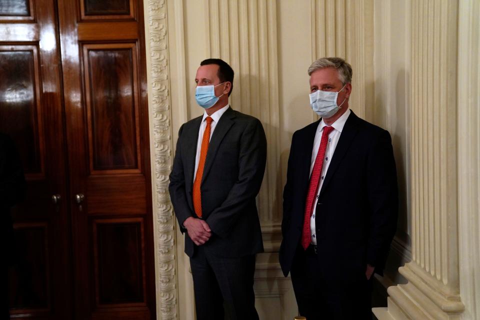 White House national security adviser Robert O'Brien, right, listens as President Donald Trump meets with Republican lawmakers in the State Dining Room of the White House, Friday, May 8, 2020.
