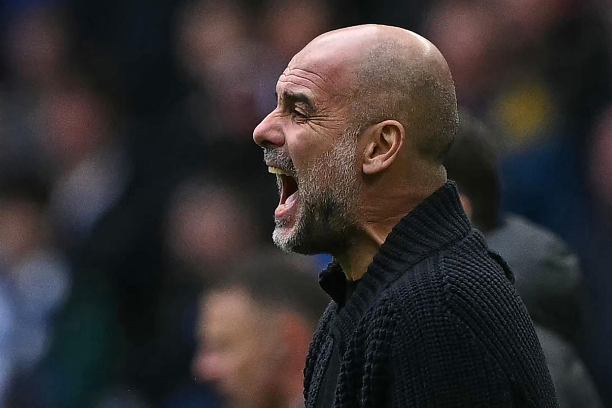 Manchester City manager Pep Guardiola shouts on the touchline during the FA Cup semi-final against Chelsea at Wembley Stadium.