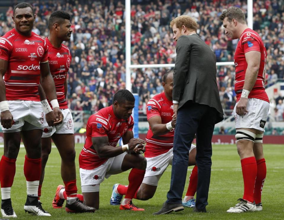 Prince Harry meets the teams at Twickenham stadium in London, ahead of the Army V Royal Navy annual rugby match (PA)