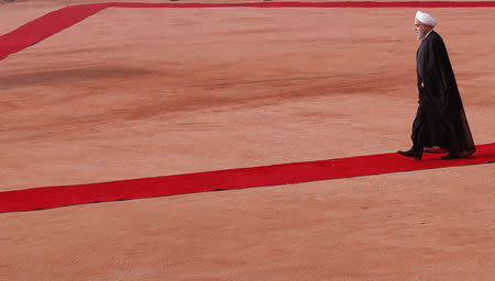 FILE PHOTO: Iranian President Hassan Rouhani inspects an honour guard during his ceremonial reception in New Delhi, India, February 17, 2018. REUTERS/Adnan Abidi/File Photo