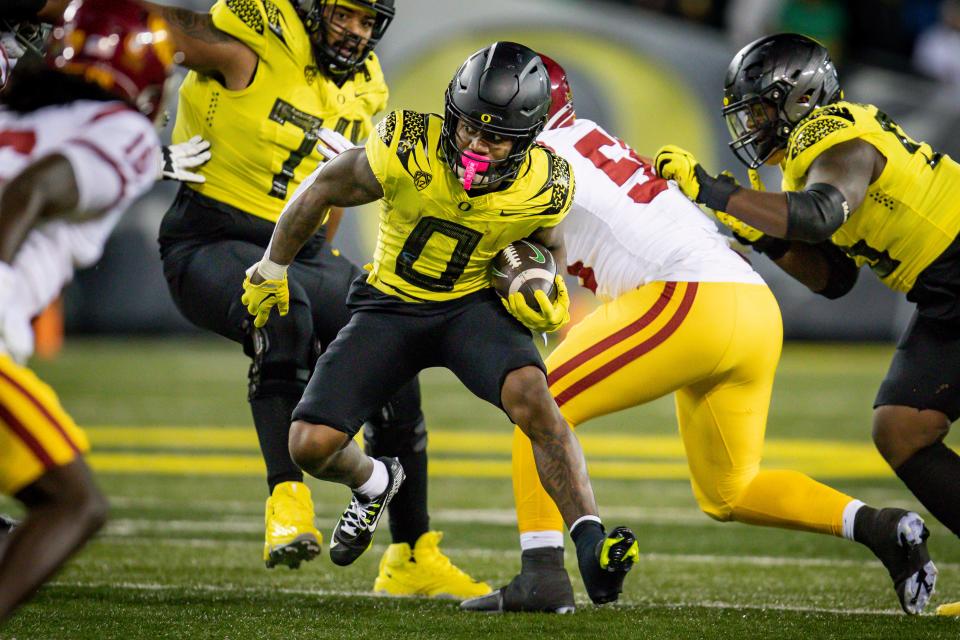 Oregon running back Bucky Irving takes off with the ball as the No. 6 Oregon Ducks host the USC Trojans Saturday, Nov. 11, 2023, at Autzen Stadium in Eugene, Ore.