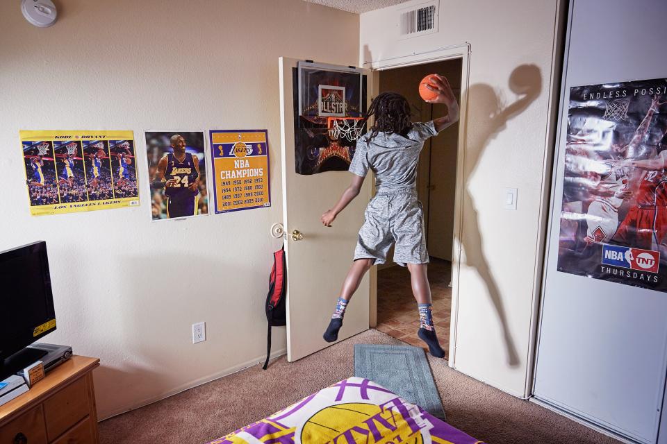 King-Riley Owens, 9, who is ranked as a five-star prospect by the National Youth Basketball Report, lives in L.A. but has already played in tournaments in Utah, Texas and Nevada. His parents have used GoFundMe to help pay for the travel. If the NBA doesn’t work out, King-Riley wants to be a veterinarian. Here King-Rily is photographed at home on Aug. 2, 2017.