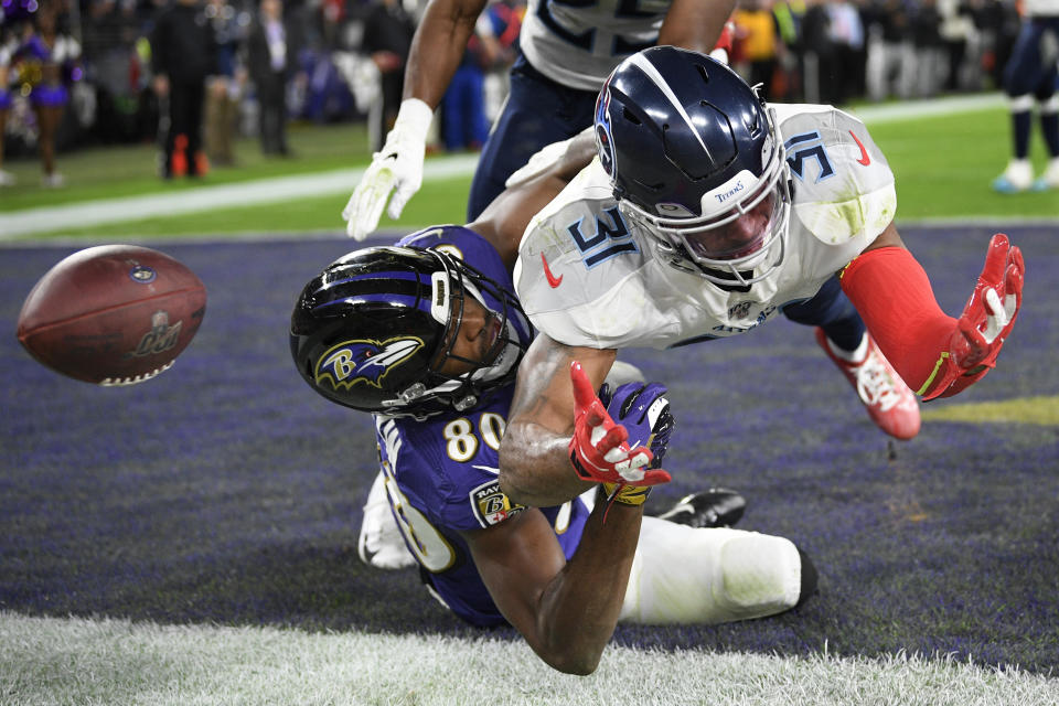 Baltimore Ravens wide receiver Miles Boykin misses the catch on a two-point conversion against Tennessee Titans free safety Kevin Byard during the second half of an NFL divisional playoff football game in Baltimore on Jan. 11, 2020. (AP Photo/Nick Wass)