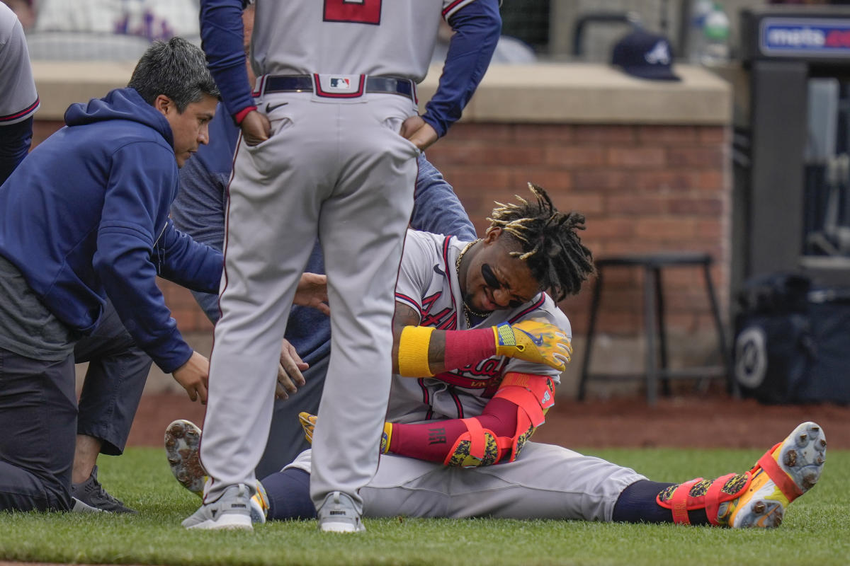 ATLANTA, GA - JULY 12: Atlanta Braves right fielder Ronald Acuna Jr. (13)  flips his bat after drawing a walk during an MLB game against the New York  Mets on July 12