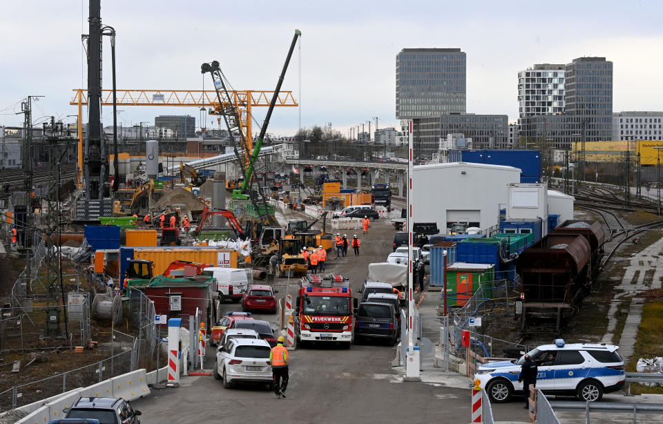 Fire brigades and policemen work at the site of a bomb explosion close to the main railway station in Munich, southern Germany, on December 1, 2021. - According to media reports, four persons were injured, one of them seriously, when a World War II bomb exploded as works were under way at a construction site close to the railway station. (Photo by CHRISTOF STACHE / AFP) (Photo by CHRISTOF STACHE/AFP via Getty Images)