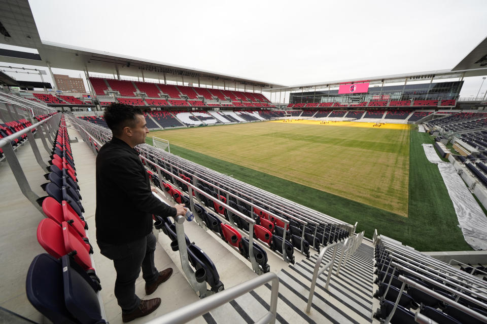 St. Louis City SC chief experience officer Matt Sebek looks out over the pitch inside CityPark Stadium Friday, Jan. 13, 2023, in St. Louis. When season tickets sales began for Major League Soccer's newest team, St. Louis City SC leaders figured they'd be a hot ticket in a city with a deep love for the sport. (AP Photo/Jeff Roberson)