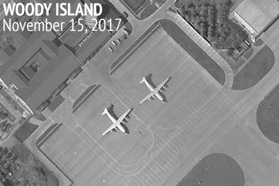 A satellite image of Woody Island in the Paracel island chain showing two Chinese Y-8 military transport aircraft.