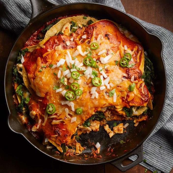 <p>Put out your favorite toppings for these quick and healthy layered enchiladas. We like cilantro, sour cream, guacamole and jalapeños. <a href="https://www.eatingwell.com/recipe/260921/adobo-chicken-kale-enchiladas/" rel="nofollow noopener" target="_blank" data-ylk="slk:View Recipe" class="link rapid-noclick-resp">View Recipe</a></p>
