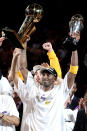 Lakers guard Kobe Bryant holds up the Larry O'Brien trophy and the MVP trophy after leading the Lakers past the Boston Celtics in Game 7 of the NBA Finals on June 17, 2010, in Los Angeles. (Photo by Christian Petersen/Getty Images)