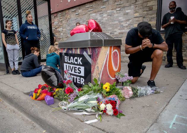 Many carried flowers and placed them near the site where George Floyd, a middle-aged Black man, died after a confrontation with Minneapolis police.