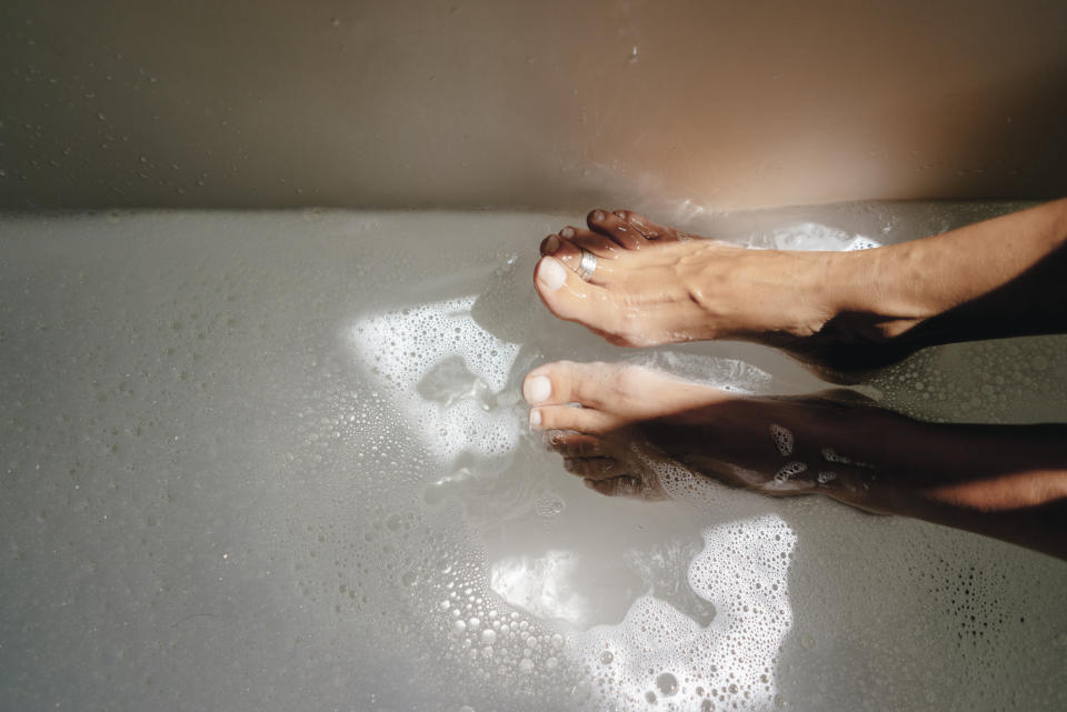 Feet soaking in a tub