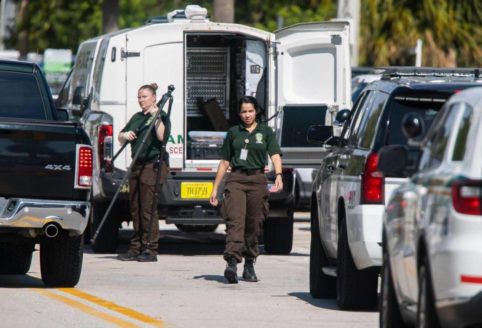 Police officers work a crime scene near 7920 East Dr. on Monday, Nov. 28, 2022, in North Bay Village, Fla. A man was killed, a woman was wounded and another man is in custody following a domestic-related shooting, authorities said.