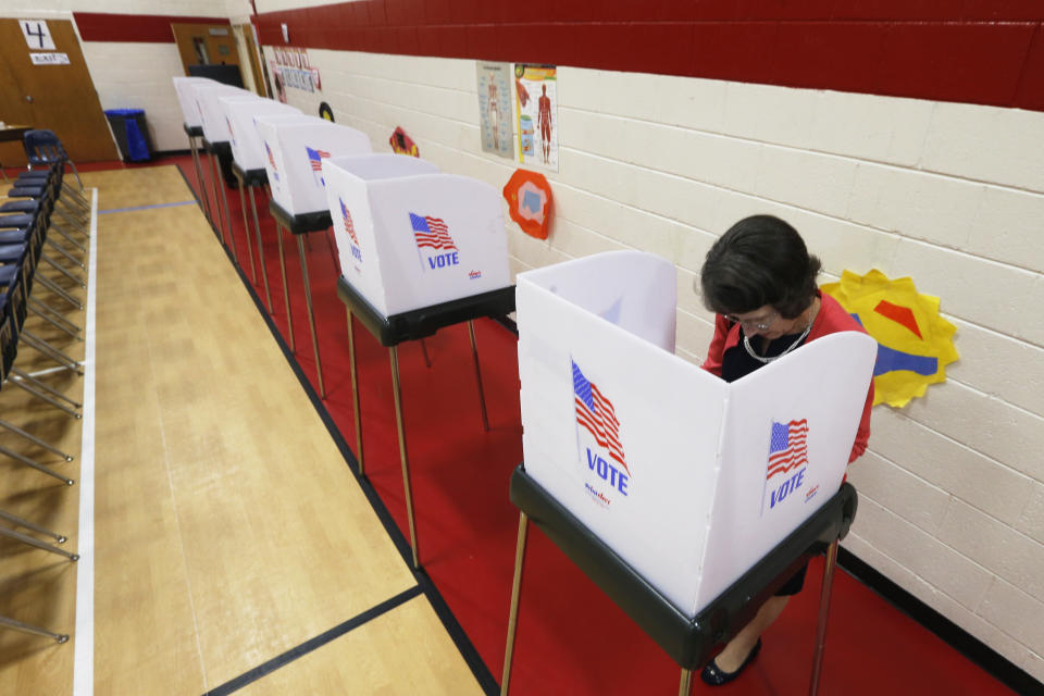 A voter makes her choice during the Democratic Presidential primary voting Tuesday, March 3, 2020, in Richmond, Va. (AP Photo/Steve Helber)