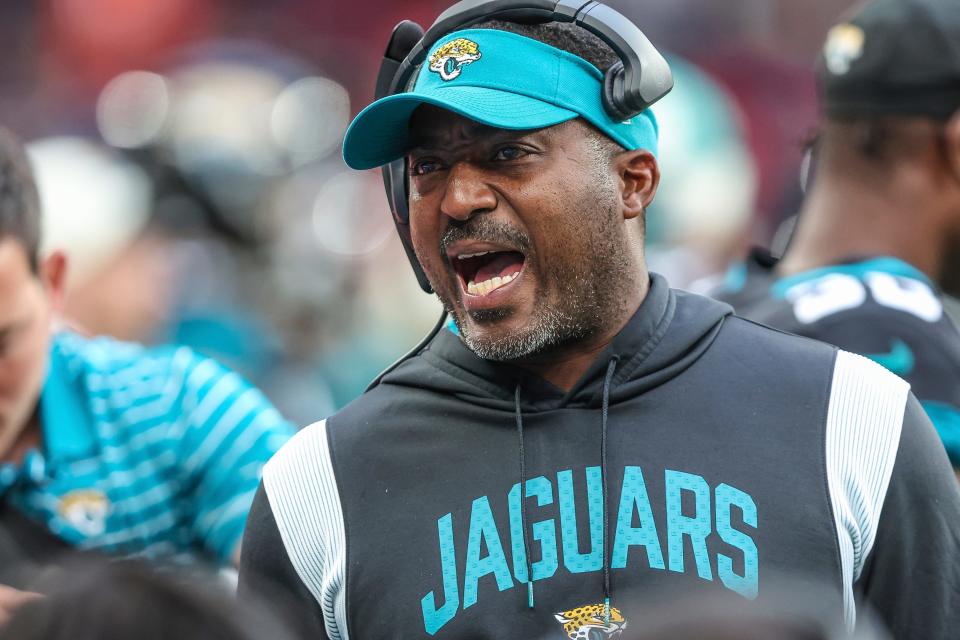 Jacksonville Jaguars passing game coordinator Deshea Townsend talks to players on the sideline during an NFL football game against the Denver Broncos at Wembley Stadium in London on Sunday, Oct. 30, 2022. Broncos defeated the Jaguars 21-17. (AP Photo/Gary McCullough)