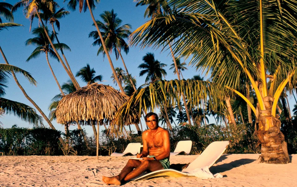 Paul Theroux on a beach in Tahiti, French Polynesia, 1991 - Getty