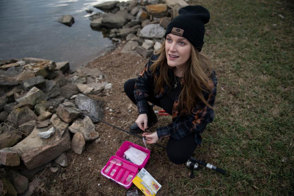 Kasey Tyndall prepares a fishing line at Old Hickory Pier in Old Hickory , Tenn., Friday, Feb. 10, 2023.