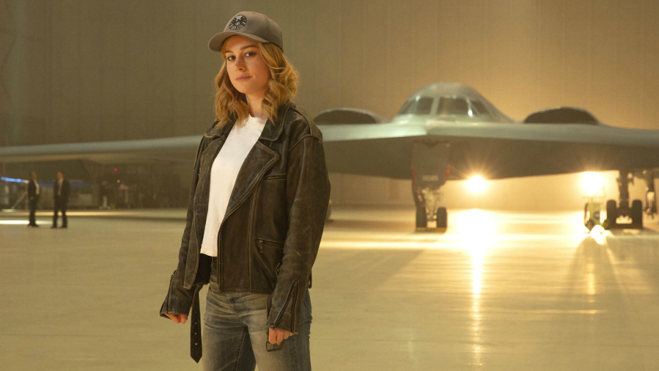 Carol Danvers in front of a jet