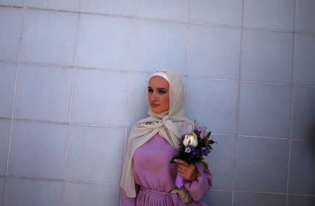 Bosnian Muslim bride waits for a collective Sharia wedding ceremony for sixty couples in Sarajevo, Bosnia and Herzegovina July 19, 2018. REUTERS/Dado Ruvic