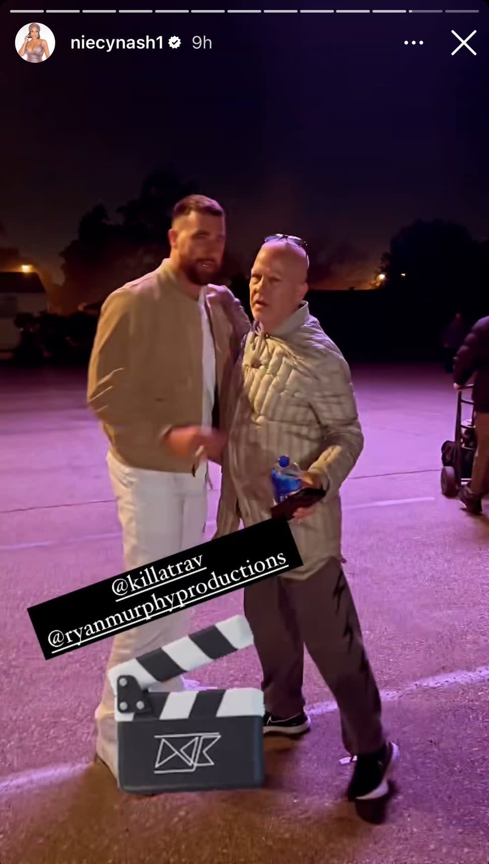 Travis Kelce hugs Ryan Murphy on the set of 'Grotesquerie.'