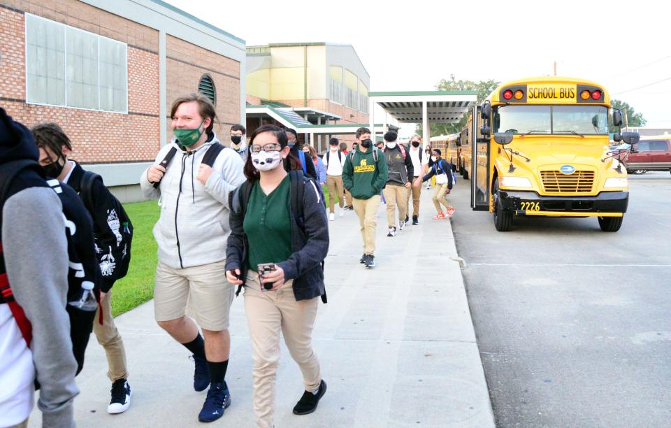 Students enter Central Lafourche High in Mathews on Thursday for first day of the new school year.