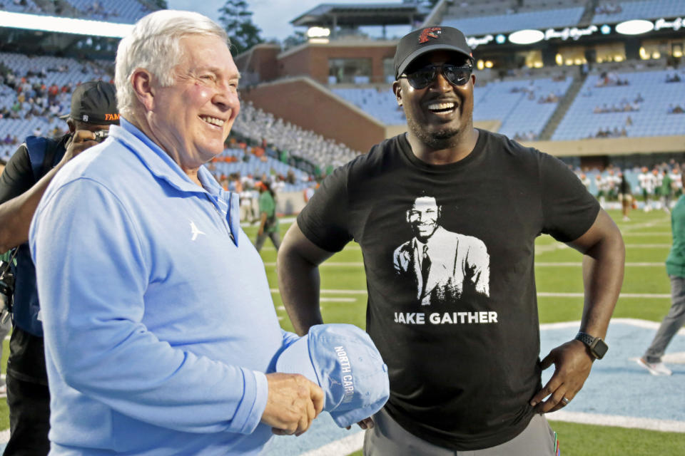 North Carolina head coach Mack Brown, left, and Florida A&M head coach Willie Simmons talk before an NCAA college football game in Chapel Hill, N.C., Saturday, Aug. 27, 2022. (AP Photo/Chris Seward)