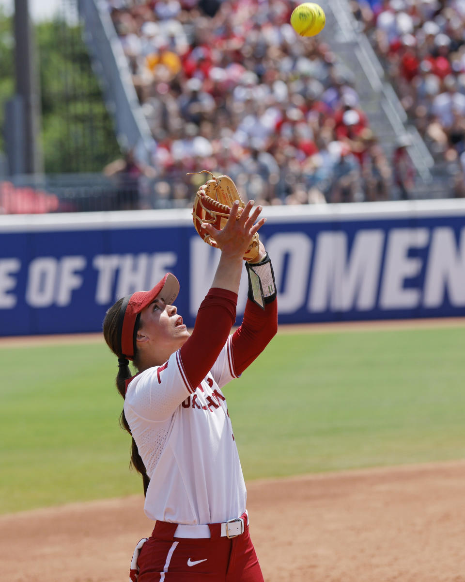 Oklahoma's Grace Lyons makes a catch for an out against Stanford during the fourth inning of an NCAA softball Women's College World Series game Monday, June 5, 2023, in Oklahoma City. (AP Photo/Nate Billings)