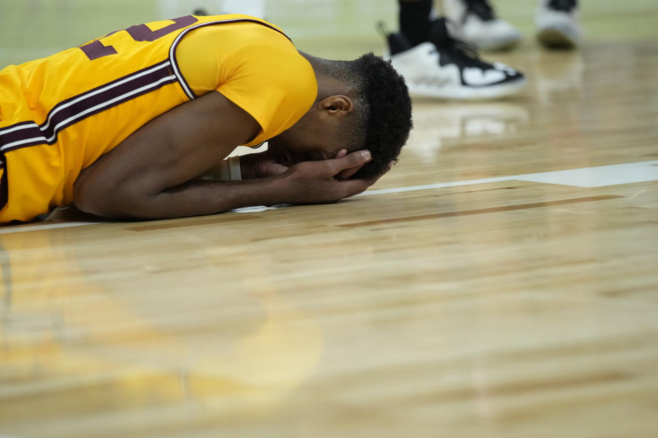 Arizona State's Alonzo Gaffney (32) holds his head after a play against Stanford. (AP Photo/John Locher)