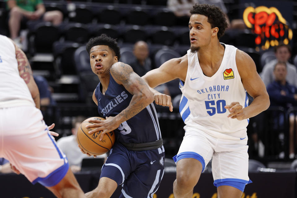 Memphis Grizzlies guard Ronaldo Segu (9) drives to the basket against Oklahoma City Thunder forward Jeremiah Robinson-Earl (50) during the first half of an NBA summer league basketball game Wednesday, July 6, 2022, in Salt Lake City. (AP Photo/Jeff Swinger)