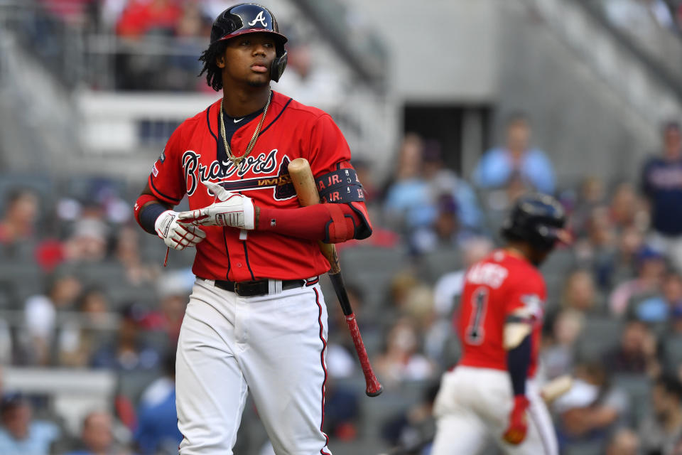 Atlanta Braves center fielder Ronald Acuna Jr. (13) walks back to the dugout after striking out against the St. Louis Cardinals in the fifth inning during Game 2 of a best-of-five National League Division Series, Friday, Oct. 4, 2019, in Atlanta. (AP Photo/John Amis)