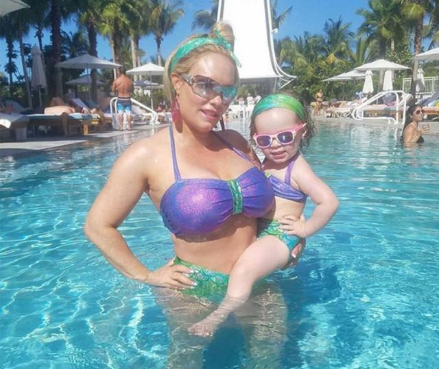 Coco Austin and baby Chanel in matching bikinis in the pool while