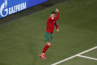 Portugal's Cristiano Ronaldo celebrates after scoring on a penalty kick during the Euro 2020 soccer championship group F match between Portugal and France at the Ferenc Puskas stadium in Budapest, Hungary, Wednesday, June 23, 2021. (AP Photo/Laszlo Balogh, Pool)