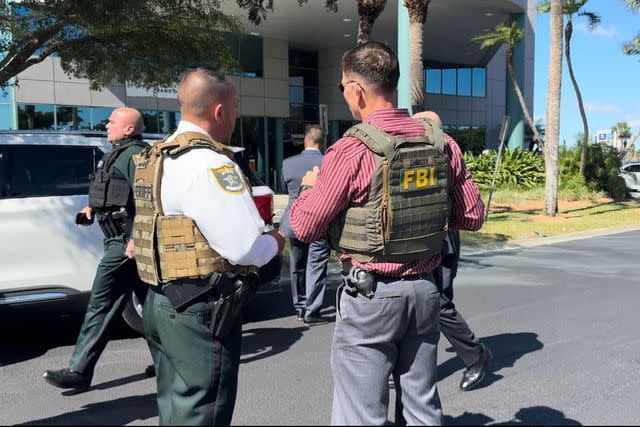 <p>Lee County Sheriff's Office/X</p> FBI respond to the scene of a bank robbery and hostage situation at the Bank of America in Bell Tower, Fla.