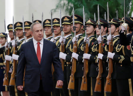 Israeli Prime Minister Benjamin Netanyahu inspects honour guards during a welcoming ceremony at the Great Hall of the People in Beijing, China March 20, 2017. REUTERS/Jason Lee