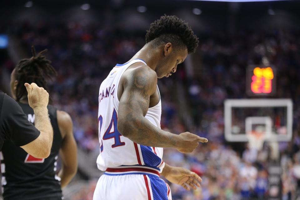 Kansas junior forward KJ Adams Jr. (24) reacts after scoring against Cincinnati during the first half of a Big 12 Conference tournament second round game Wednesday inside the T-Mobile Center in Kansas City.