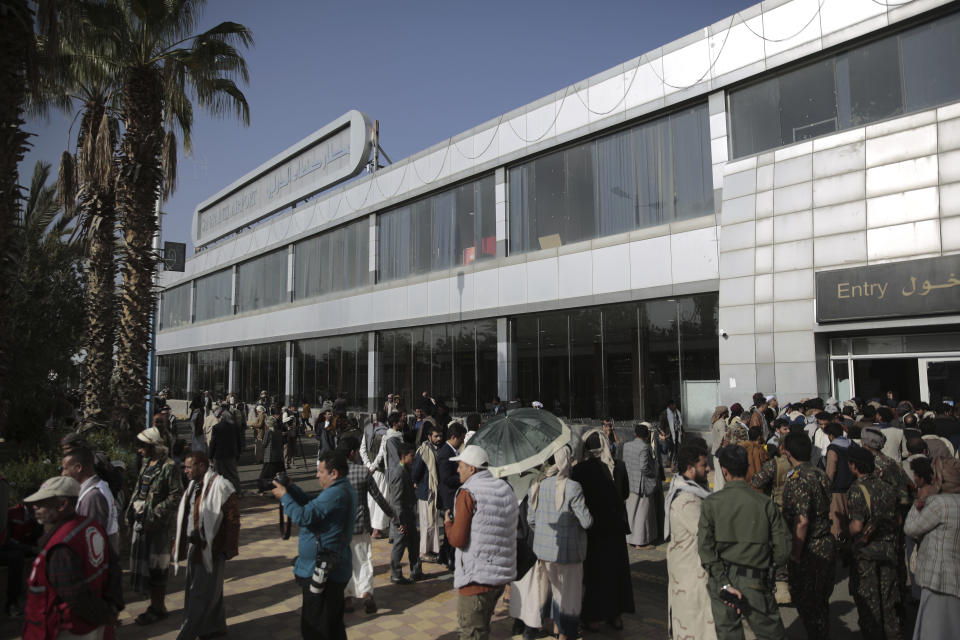 Yemeni gather at the airport ahead of a prisoners exchange in Sanaa, Yemen, Friday, April 14, 2023. An exchange of more than 800 prisoners linked to Yemen’s long-running war them began Friday, the International Committee for the Red Cross said. (AP Photo/Hani Mohammed)