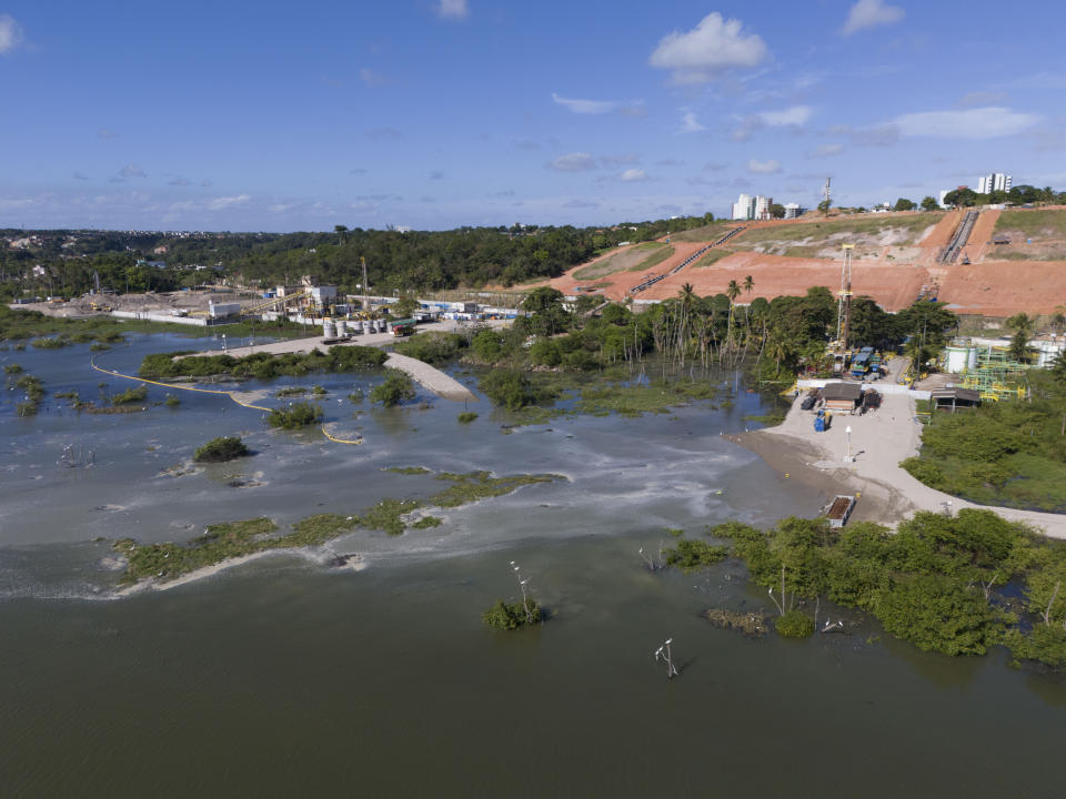 A view of sunken ground at the Mutange neighborhood in Maceio, Alagoas state, Brazil, Sunday, Dec. 10, 2023. A mine belonging to Brazilian petrochemical giant Braskem collapsed Sunday. The area had previously been evacuated and there were was no risk to any people, the authority said in its statement. (AP Photo/Itawi Albuquerque)