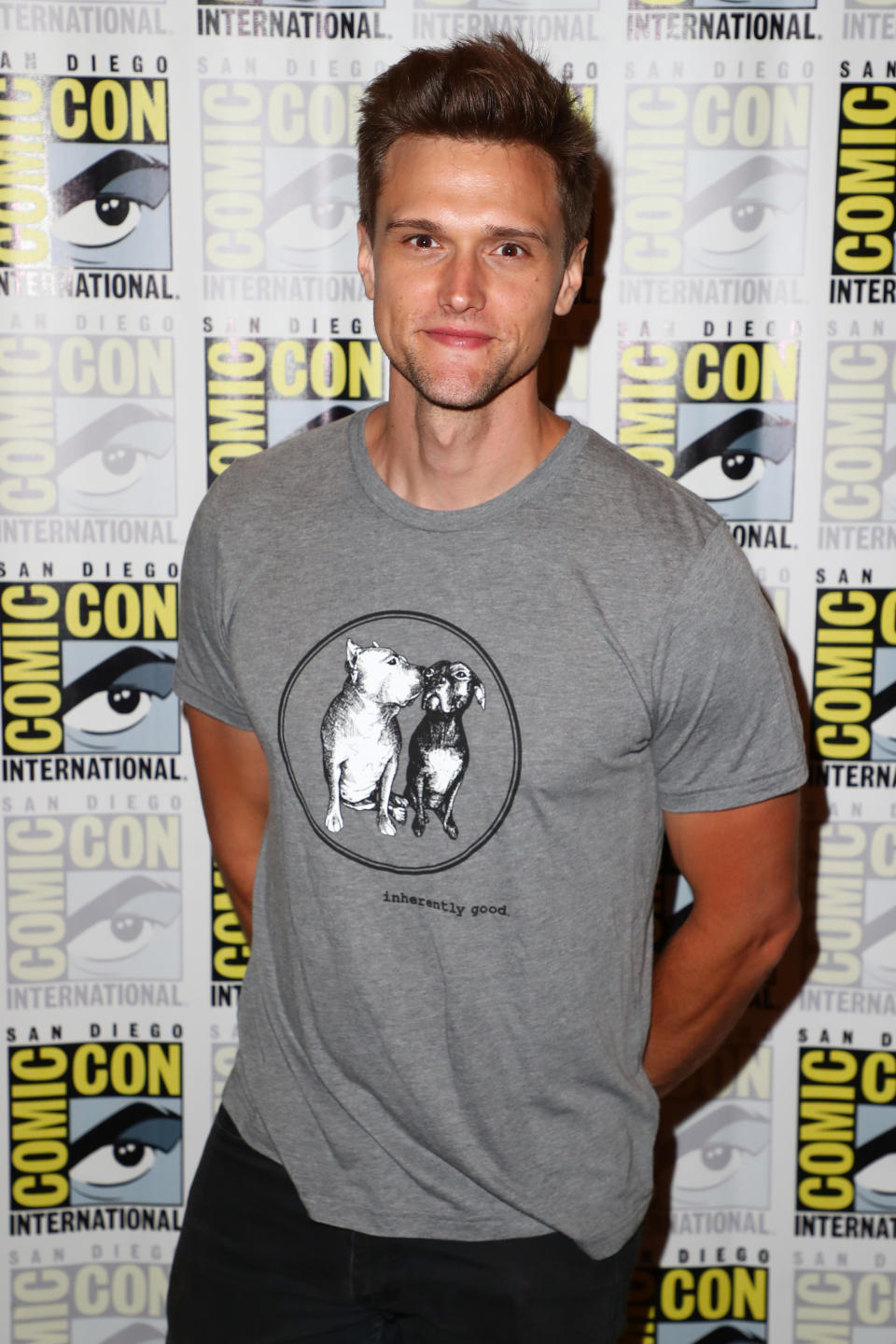 Close-up of Hartley at a media event wearing a T-shirt