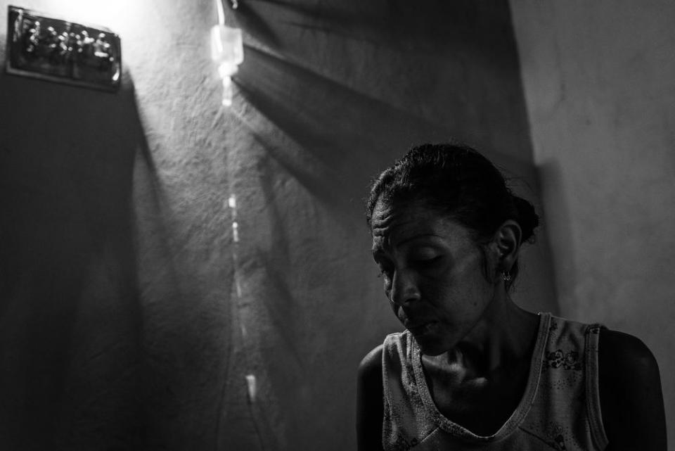 Gregoria Aular at her home in Barrio Nuevo, a slum in West Caracas. After she was diagnosed with Leukemia, she said her two sons (aged 15 and 17) turned to crime in order to finance her medical treatments. They were both allegedly executed by the police at their home. Gregoria Aular has since passed away.