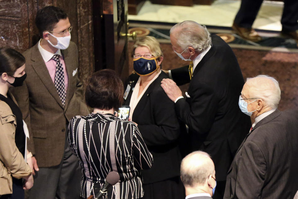 South Carolina Gov. Henry McMaster touches the shoulders of South Carolina Citizens for Life Executive Director Holly Gatling after a news conference to celebrate the likelihood of a bill banning almost all abortions passing and getting to his desk after a news conference on Wednesday, Jan. 27, 2021, in Columbia, S.C. The Senate passed the bill on an initial vote. (AP Photo/Jeffrey Collins)