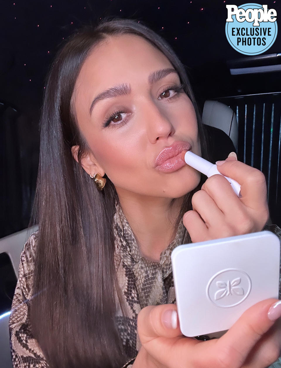 <p>"En route to the show and doing a little last-minute touchup! The <a href="https://www.amazon.com/Honest-Beauty-Moisture-Paraben-Silicone/dp/B07NTR7QDY?&linkCode=ll1&tag=pojessicaalbapfwdiaryhphillips0323-20&linkId=02798c33644b1a84d1cd1bfff91d37e0&language=en_US&ref_=as_li_ss_tl" rel="sponsored noopener" target="_blank" data-ylk="slk:Honest Beauty Tinted Lip Balm;elm:context_link;itc:0" class="link ">Honest Beauty Tinted Lip Balm</a> is moisturizing and the perfect neutral."</p>