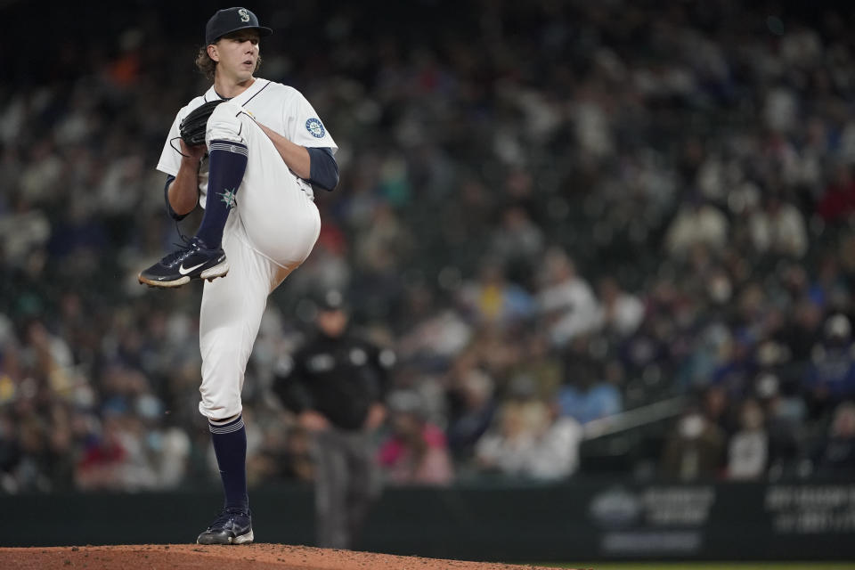 Seattle Mariners starting pitcher Logan Gilbert begins his windup against the Boston Red Sox during the fourth inning of a baseball game, Monday, Sept. 13, 2021, in Seattle. (AP Photo/Ted S. Warren)