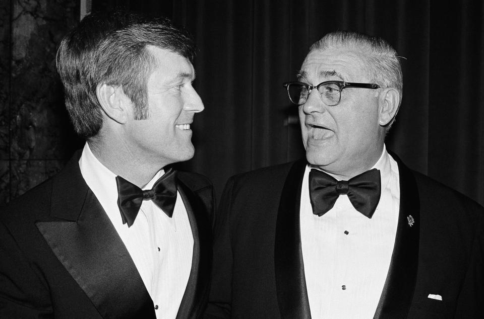 UCLA coach Dick Vermeil left, talks with Ohio state coach Woody Hayes at the National Football Foundation dinner, Dec. 9, 1975 in New York — ahead of their teams meeting in the Rose Bowl the following month. (AP Photo/Richard  Drew)