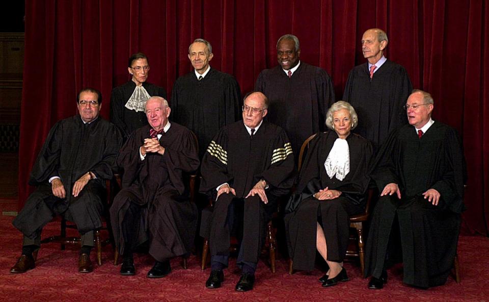 Justices of the Supreme Court of the United States pose for an official photo in December 2003 (AFP via Getty Images)