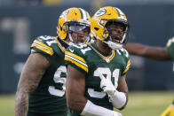 Green Bay Packers' Adrian Amos (31) reacts after intercepting a pass intended for Tampa Bay Buccaneers' Mike Evans during the second half of the NFC championship NFL football game in Green Bay, Wis., Sunday, Jan. 24, 2021. (AP Photo/Jeffrey Phelps)
