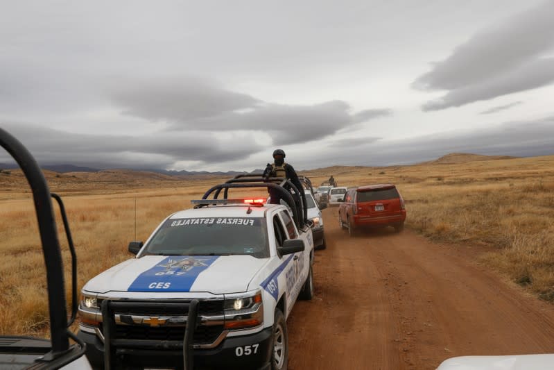 Police officers are seen during the journey to bury Rhonita Miller-Lebaron and their children who were killed by unknown assailants, on a road between Sonora state and Chihuahua state in Sonora